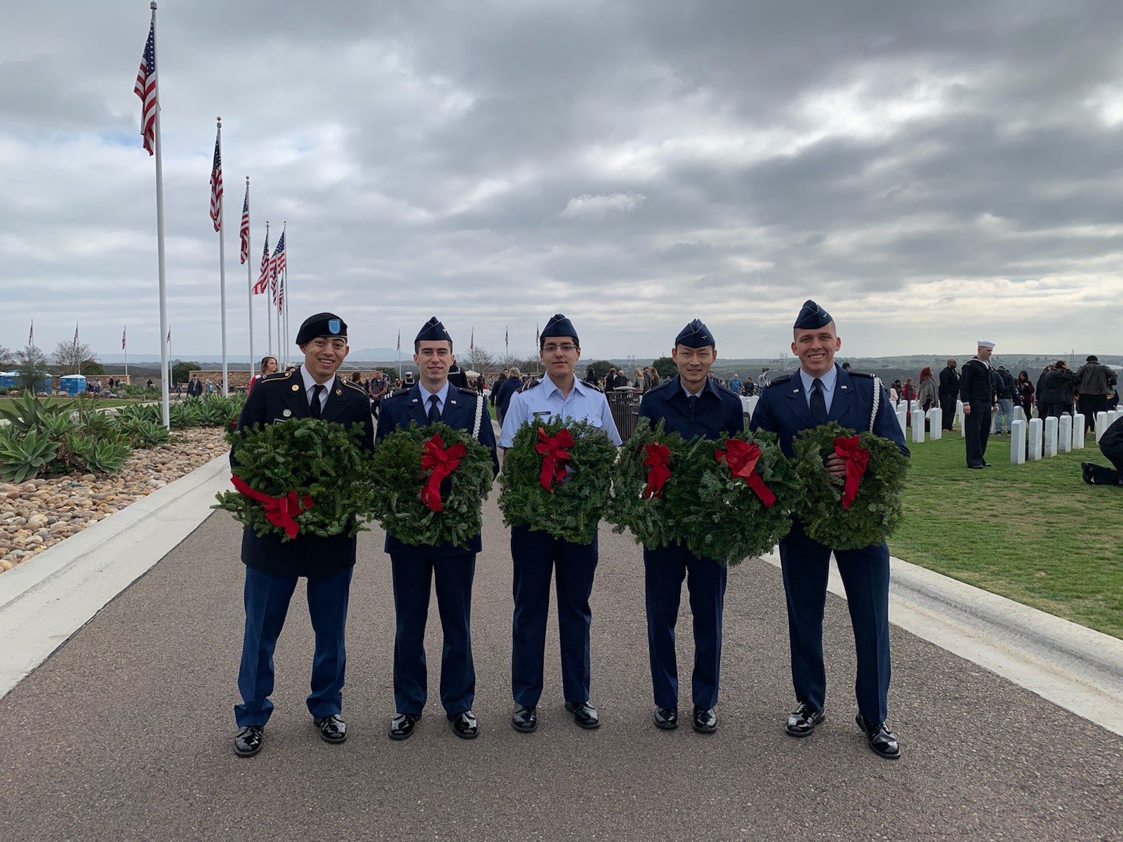 Holding wreaths at an AFROTC Det. 075 volunteer event