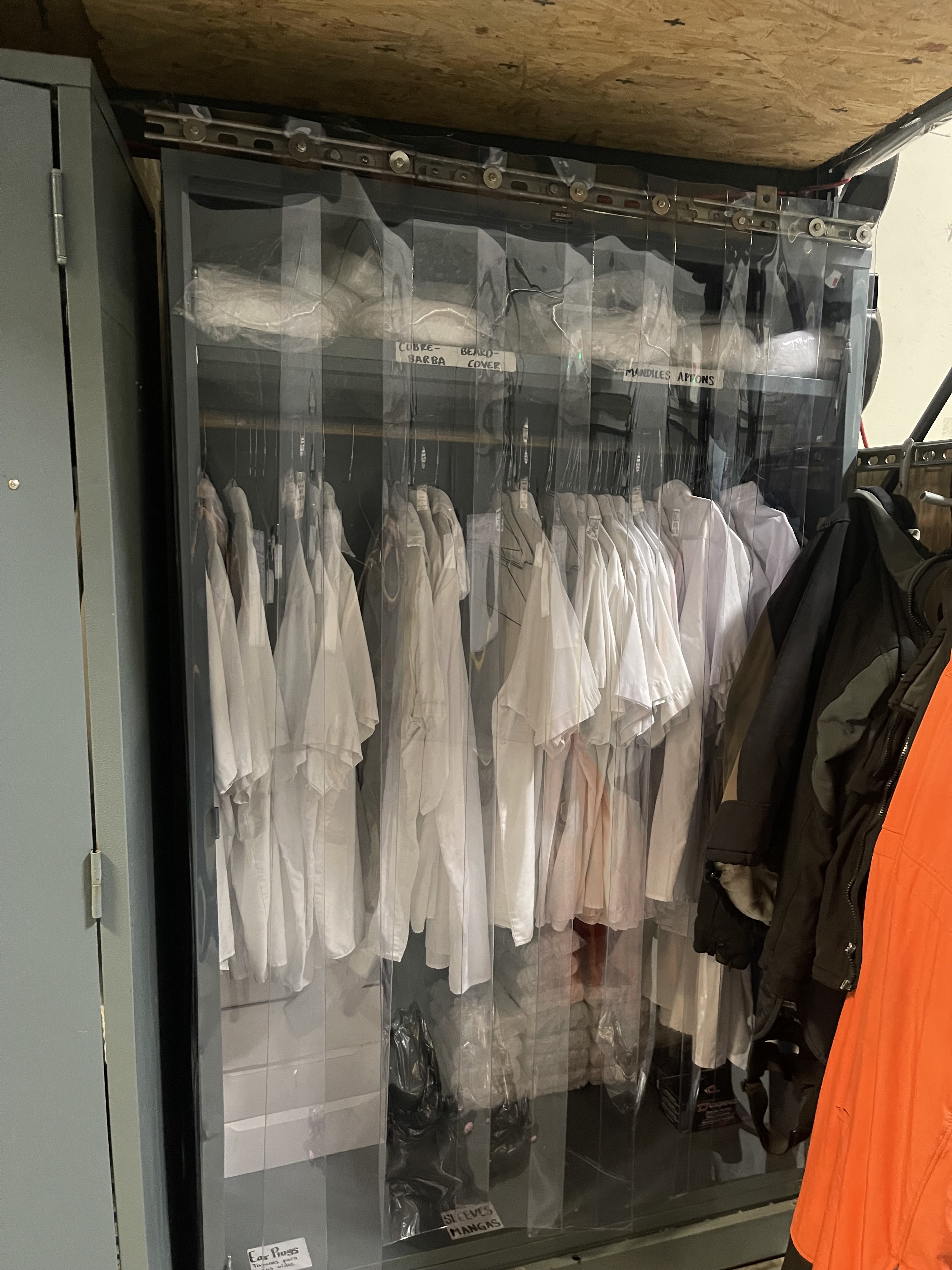 Cabinet with plastic curtain doors